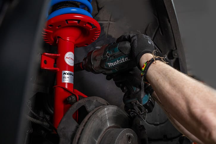 An engineer installing the KONI Special ACTIVE Shock Absorbers