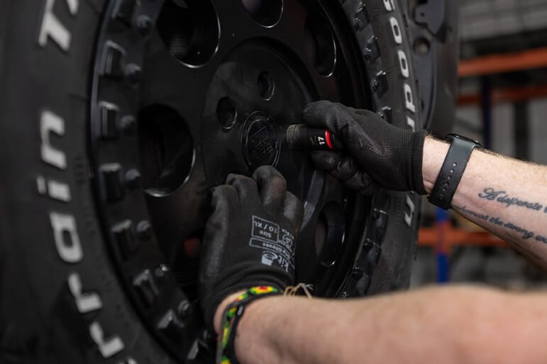 Glide-Rite's engineer working on a vehicle