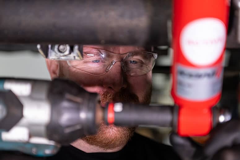 Glide-Rite's engineer installing the KONI Special ACTIVE Shock Absorbers